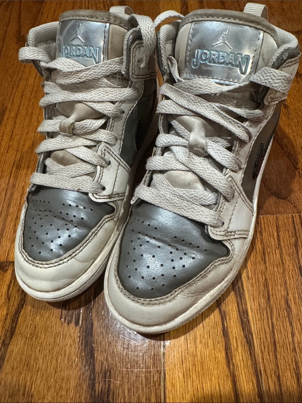 Nike Kids Air Jordan high top Sneakers in White, Silver, and Black